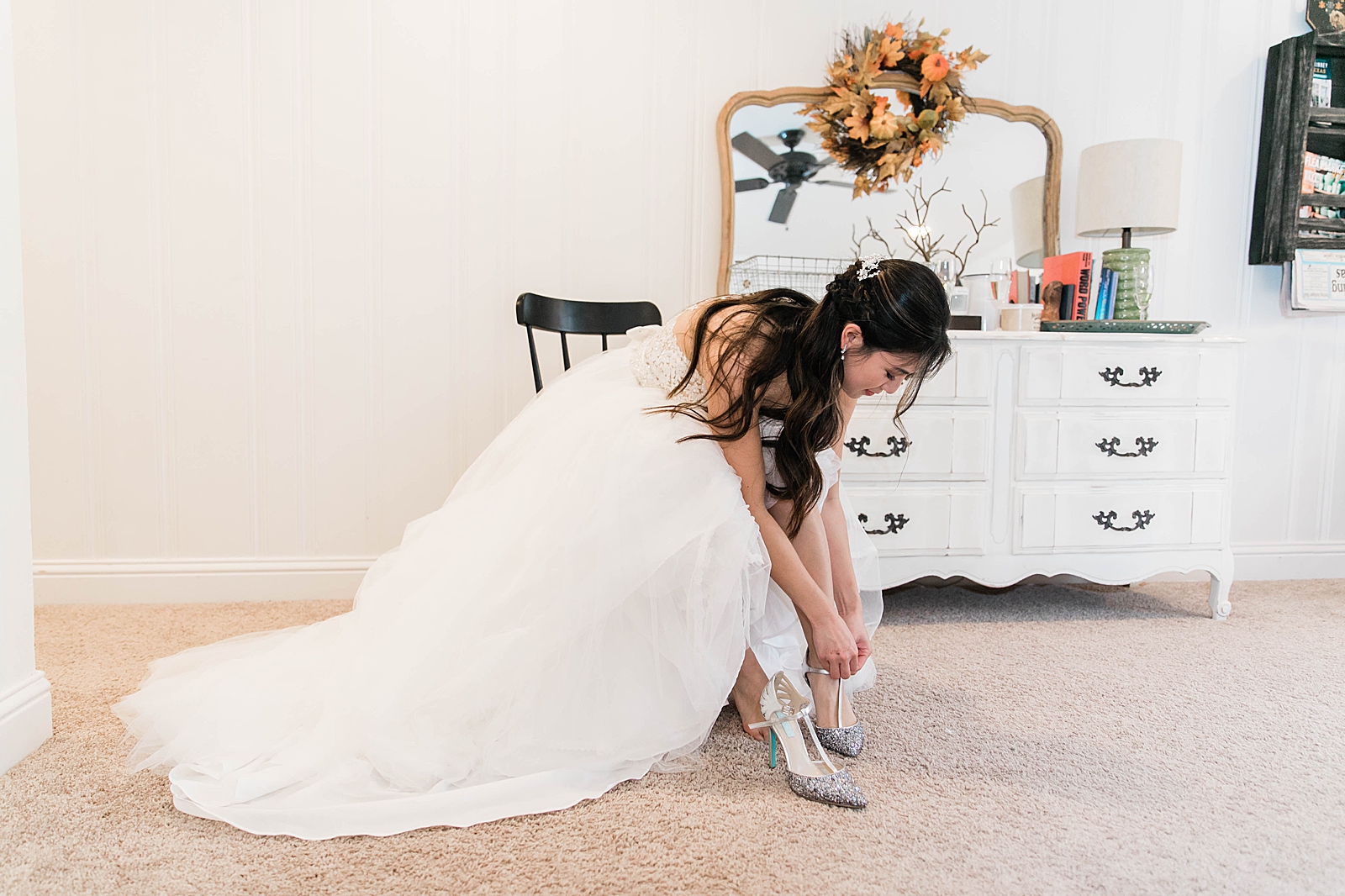 Bride putting her wedding shoes on