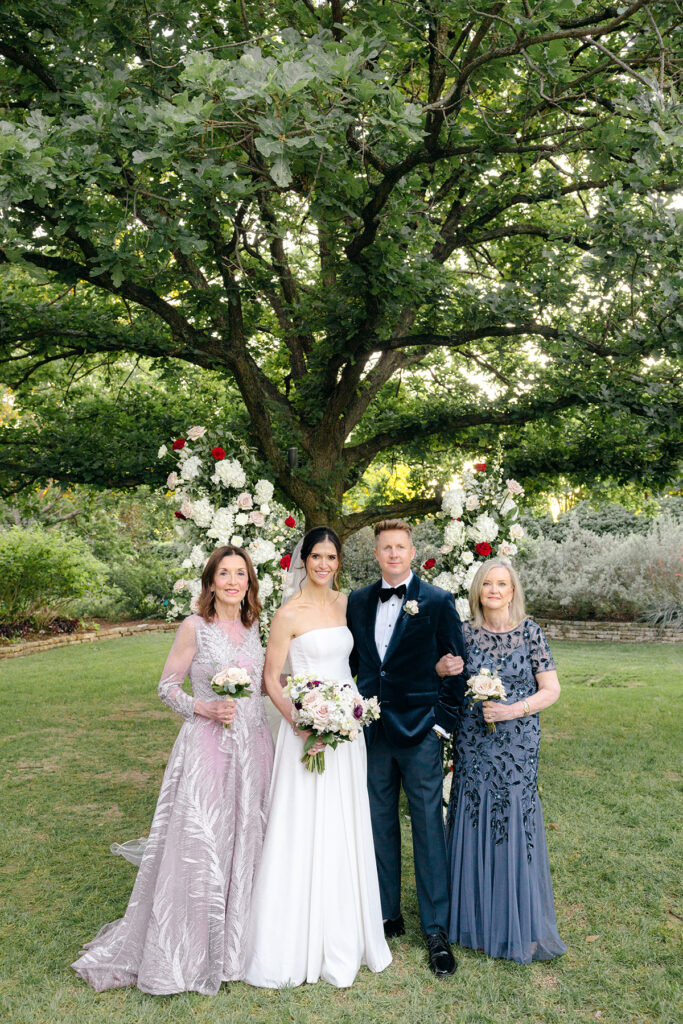 Wedding family portrait of the bride and groom at Dallas Arboretum